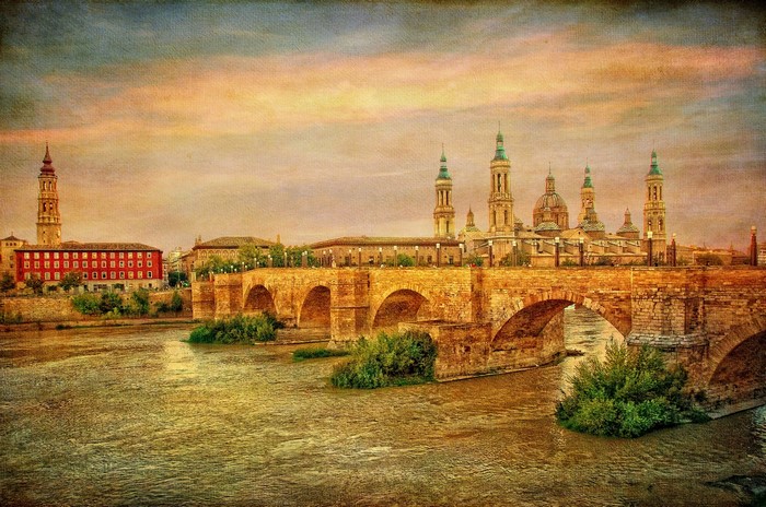 Stone bridge and basilica in Zaragoza, Spain