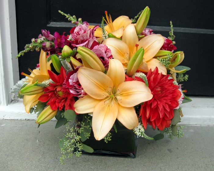Orange lilies and red dahlias in a bouquet