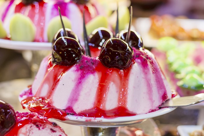 Dessert with cherries and pink glaze