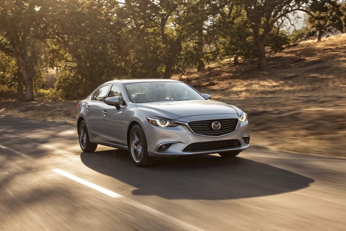 Silver 2016 Mazda 6 driving on a road
