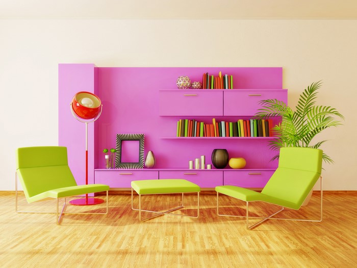 Modern living room with pink shelves and green chairs