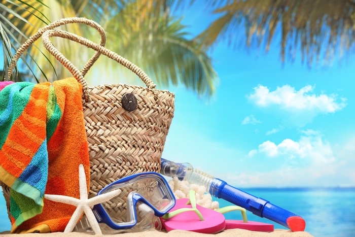 Summer beach bag with starfish, snorkel, and flip-flops