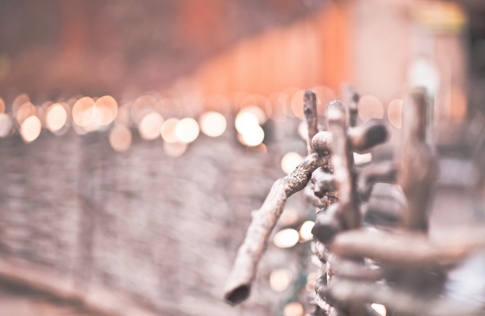 Winter fence with bokeh lights