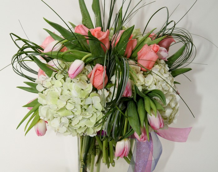 Pink roses and tulips with white hydrangea bouquet