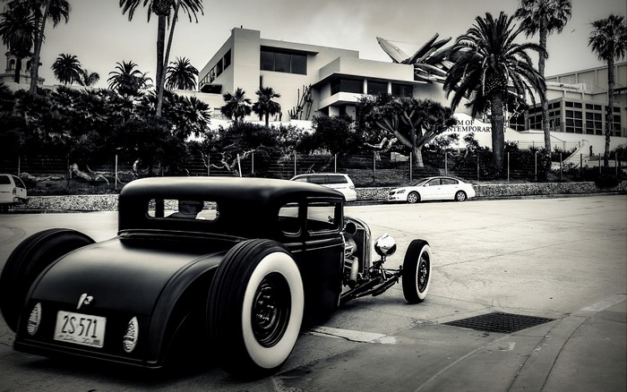 Black hot rod car with white wall tires