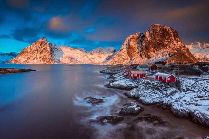 Red houses on the coast of Lofoten, Norway in winter