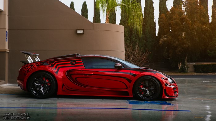 Red Bugatti Veyron with custom black stripe tuning