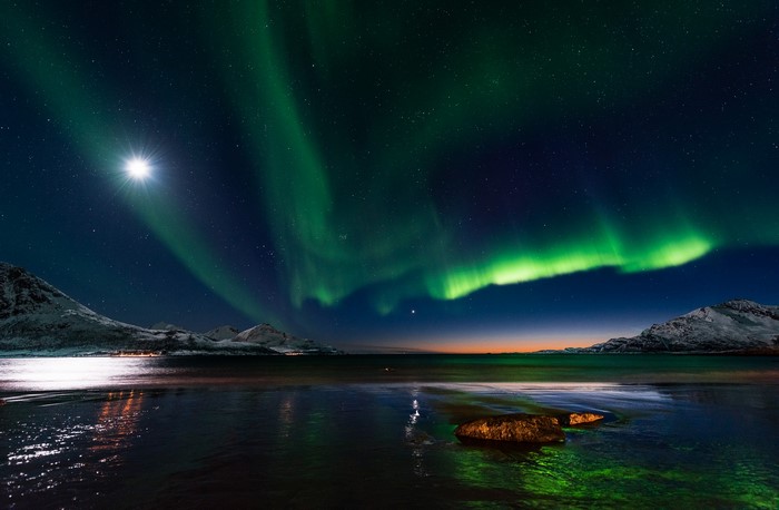 Aurora Borealis over a Norwegian Fjord at Night