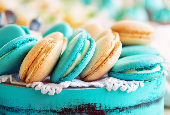 Turquoise and beige macarons on a turquoise box