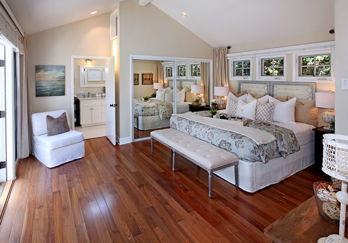 Bedroom with ensuite bathroom and armchair