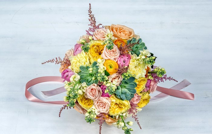 Bouquet of Roses, Ranunculus, and Succulents with Pink Ribbon