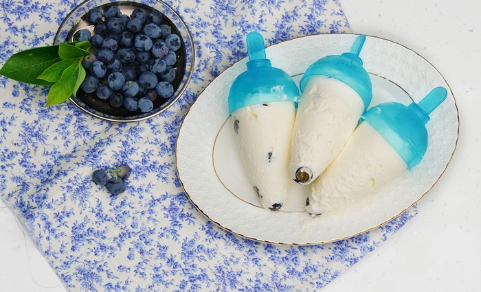 Blueberry ice cream popsicles on a plate