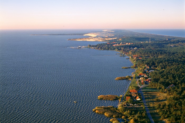 Aerial view of Nida, Lithuania coast with houses and forests