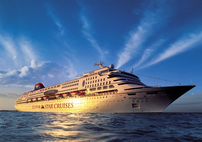 Star Aquarius cruise liner on the sea at sunset