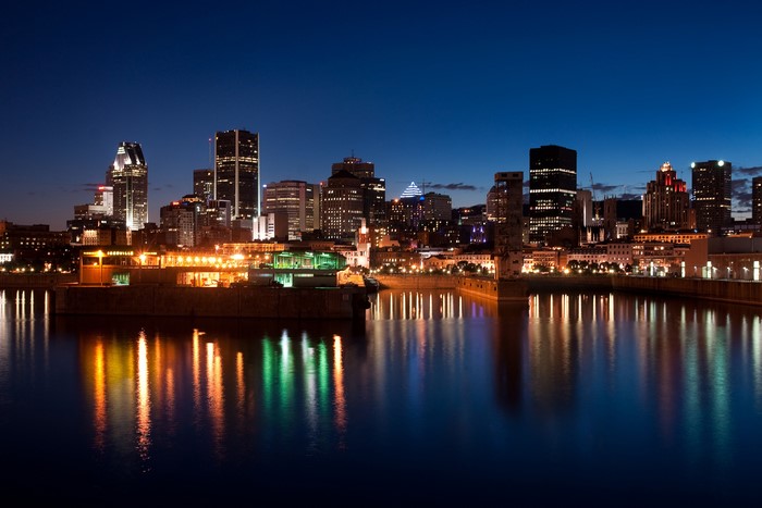 Montreal skyline at night with river reflections