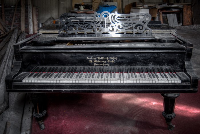 Grand piano in an abandoned room