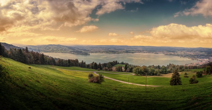 Panoramic view of Zugerberg grasslands and lake in Switzerland