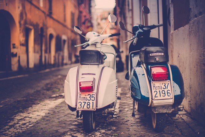Two Piaggio scooters in Rome