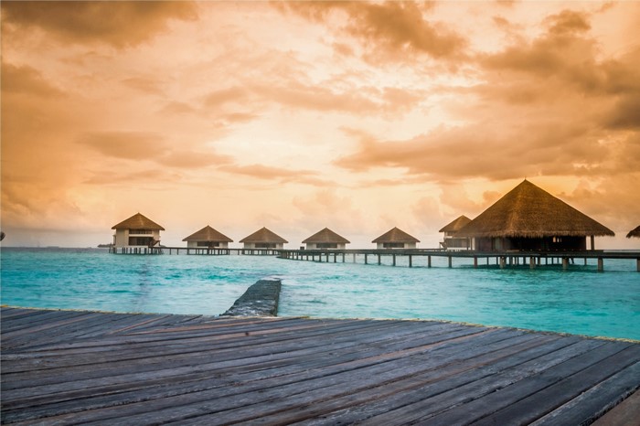 Overwater bungalows in the Maldives at sunset