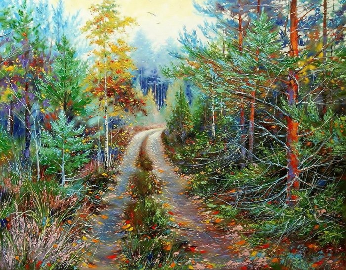 A winding dirt road through an autumn forest