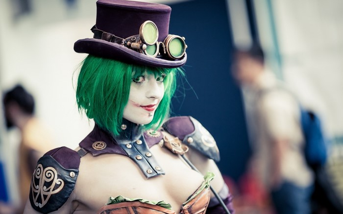 Female Joker cosplay with steampunk hat and goggles