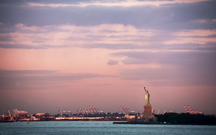 Statue of Liberty and New York City Skyline at Dusk