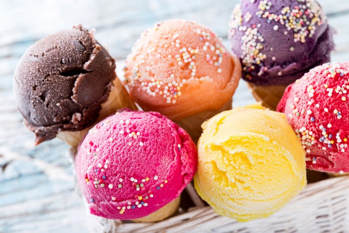 Assortment of colorful ice cream scoops with sprinkles