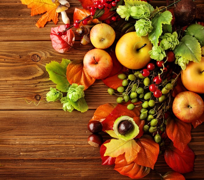 Autumn harvest arrangement with apples and leaves