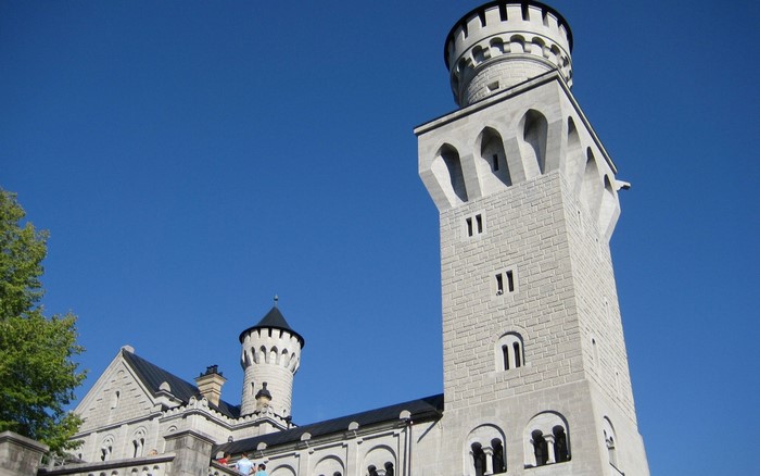 Neuschwanstein Castle towers against a blue sky