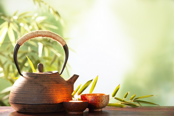 Tea set with candle and bamboo