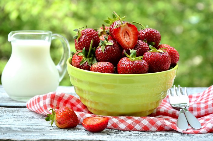 Bowl of Strawberries with Milk Pitcher