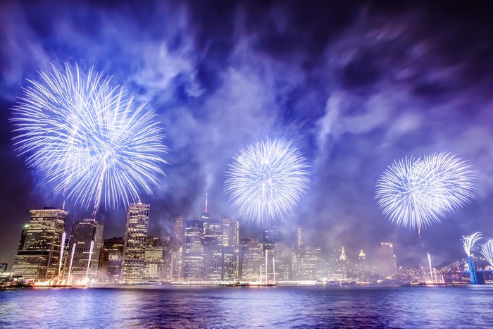 Fireworks over Manhattan skyline on East River