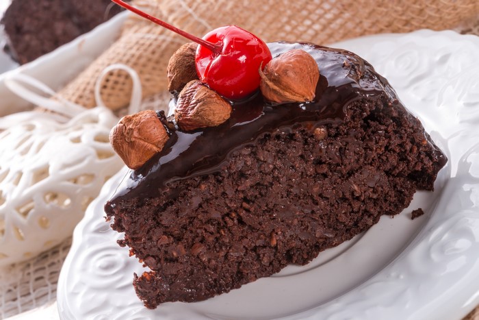 Chocolate cake with nuts and cherry