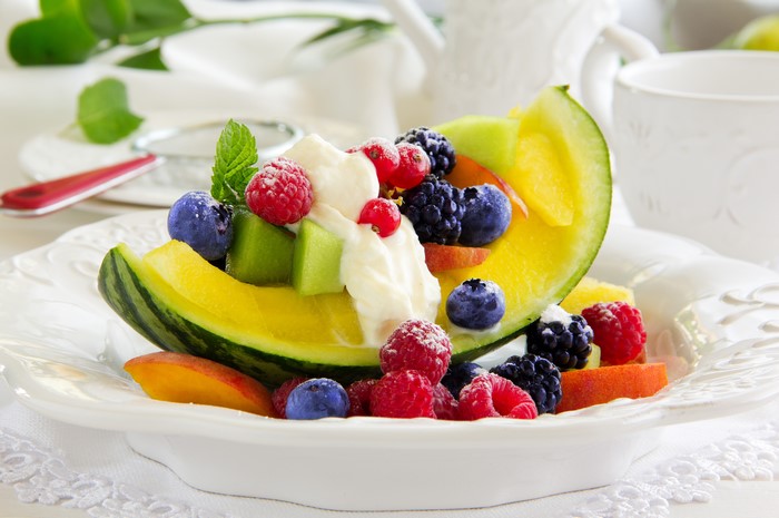Fruit salad with melon, berries, and peaches