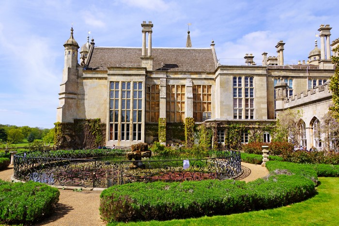Burghley House mansion with fountain and garden