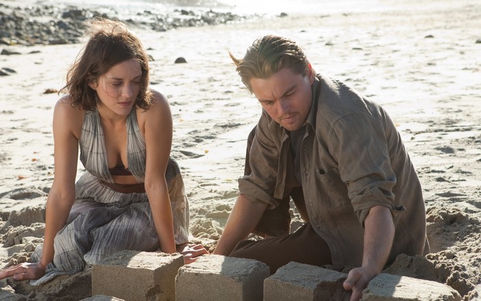 Marion Cotillard and Leonardo DiCaprio on a beach