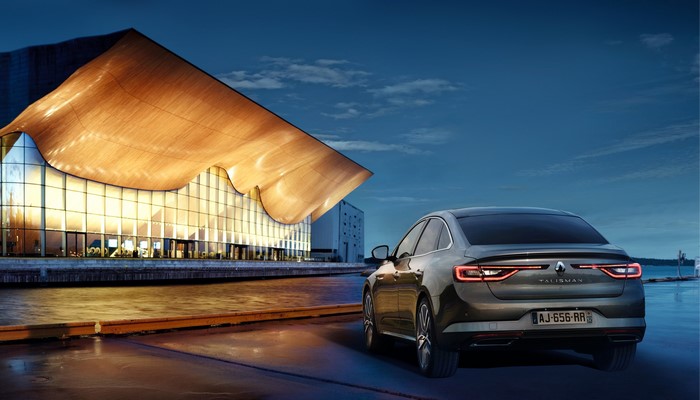 Renault Talisman sedan parked by a modern building