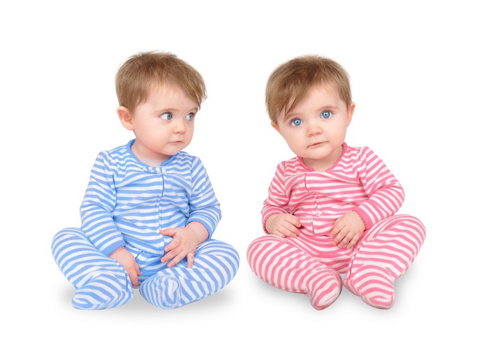 Two babies in striped pajamas
