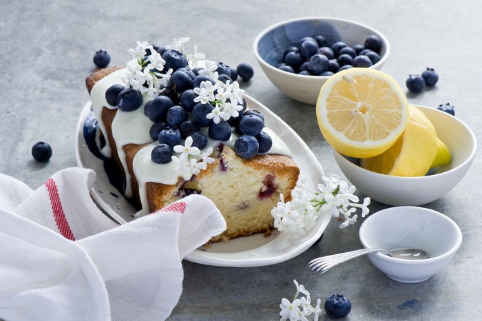 Blueberry pound cake with lemon and white flowers