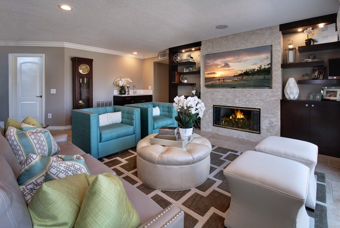 Living room with fireplace, sofa, and armchairs