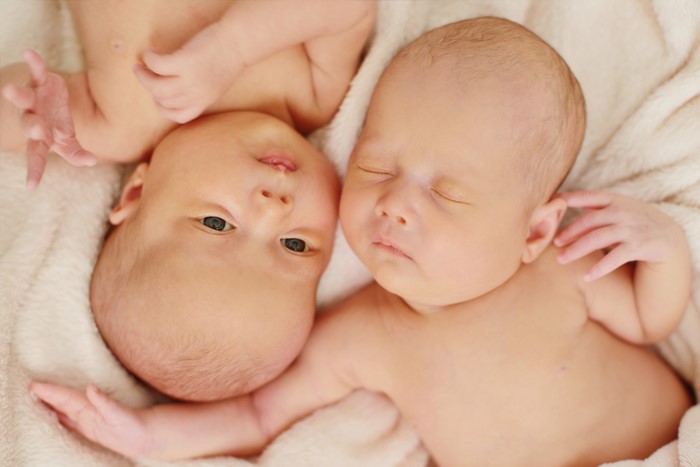 Two Newborn Infants Sleeping