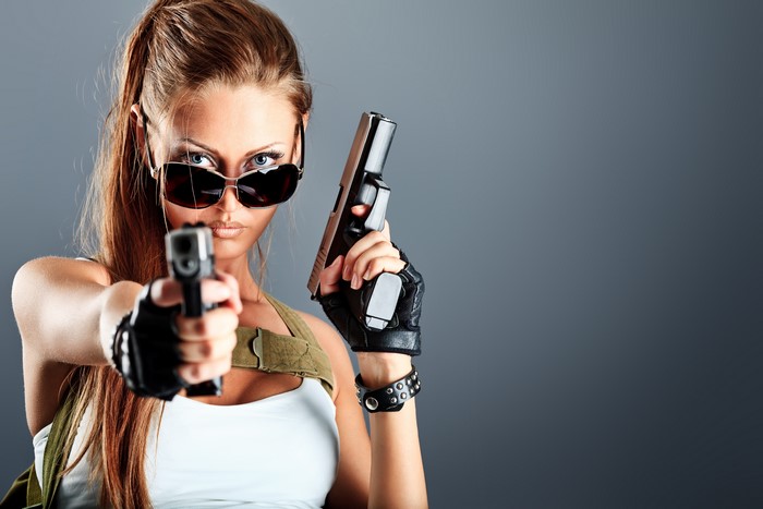 Woman with Pistols and Sunglasses