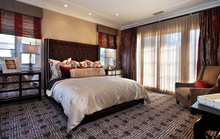 Luxury Bedroom with Tufted Headboard and Patterned Carpet