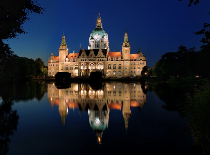 Rathaus Hannover reflected in a pond at night