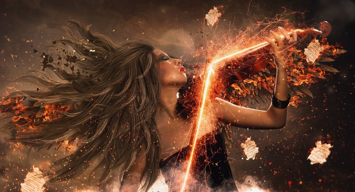 Woman playing violin with fire and sparks