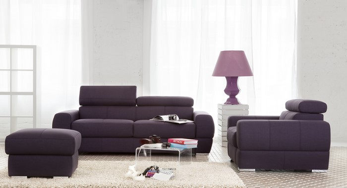 Purple Sofa and Armchair in a Living Room with Lamp