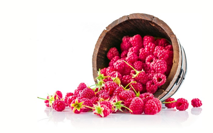 4K Raspberries in Wooden Bucket