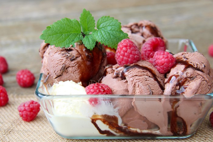 Chocolate ice cream with raspberries and mint