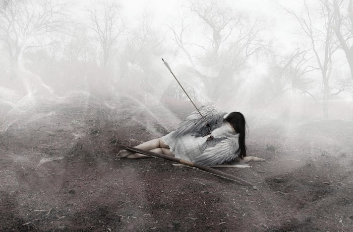 Fallen angel with arrow in wing