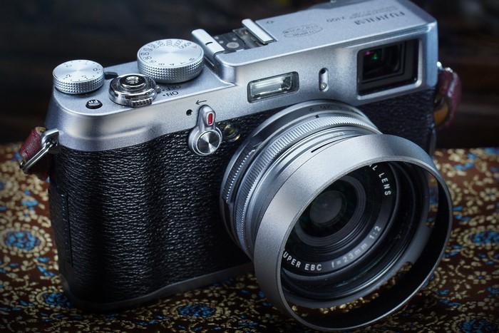 Fujifilm X100 digital camera with lens hood